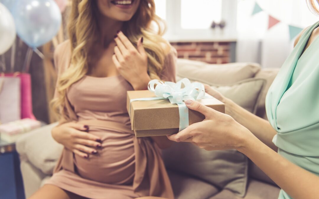 Beautiful pregnant woman and her friend are celebrating baby shower